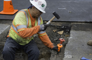 City engineer working on the street. Link to the Engineering Streets for Safety page.