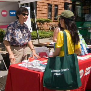 Image of a person asking giving a pedestrian information. Links to Educating the Public page.